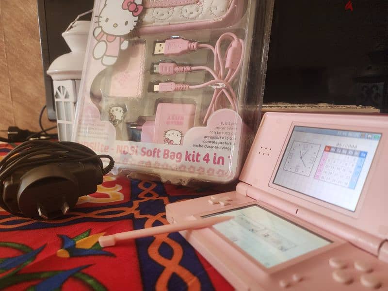 pink Nintendo ds lite with hello kitty accessories 1