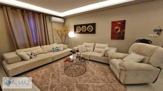 Furnished apartment with garden for rent in Al Rehab, group 74