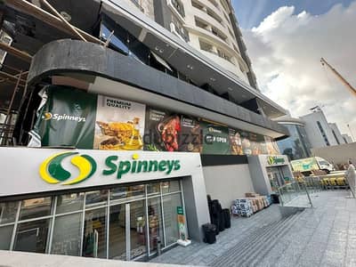 Installment and immediate receipt of a finished commercial store on Taha Hussein Street at a price lower than the market price - New Nozha - Store for