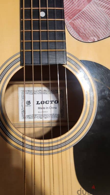 Locto Acoustic guitar with new strings with no scratches like new 4