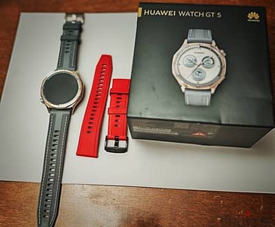 Huawei Watch GT5 barely used. Blue with extra original red strap