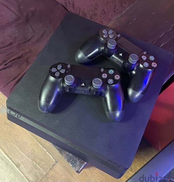 PlayStation 4 slim with 2 original controllers 1