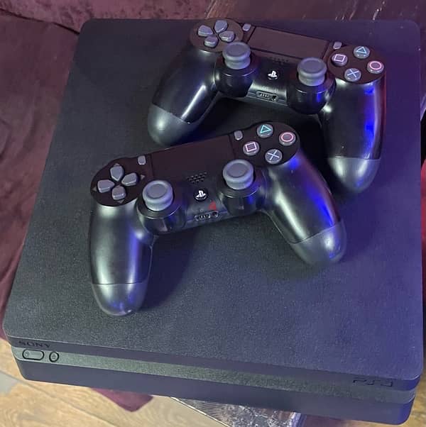 PlayStation 4 slim with 2 original controllers 2