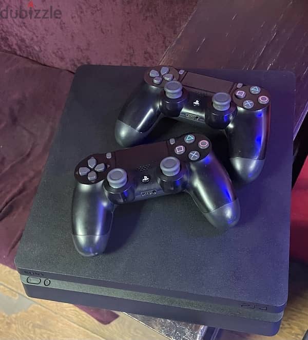 PlayStation 4 slim with 2 original controllers 3