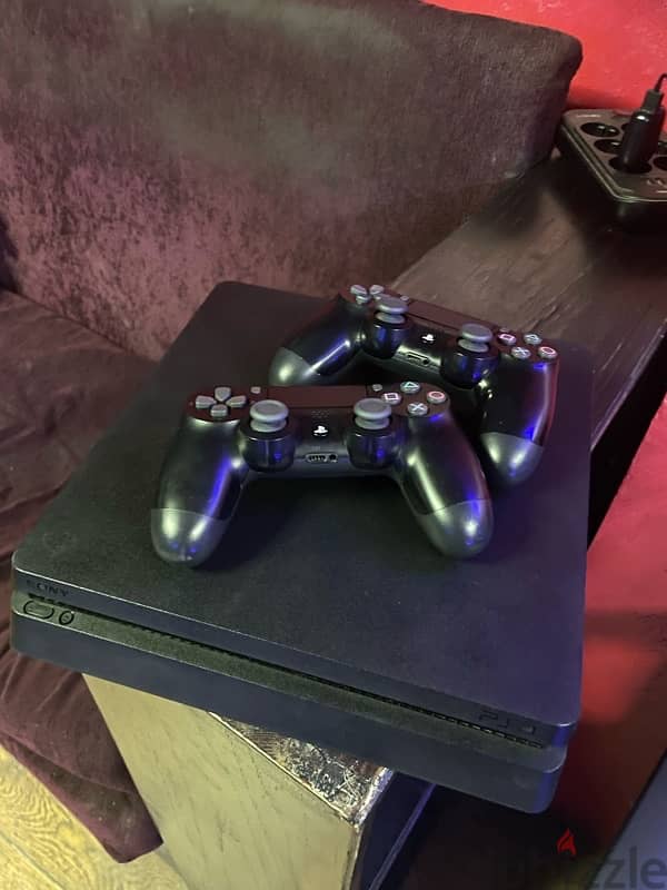 PlayStation 4 slim with 2 original controllers 4