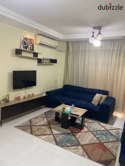 For rent furnished in Madinaty, an 82-meter apartment, fully air-conditioned, steps to services, new furniture and appliances, at a bargain price