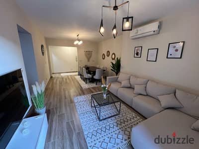 A fully furnished 2-bedroom apartment with modern furniture and contemporary finishes for rent in Eastown Compound, Fifth Settlement, New Cairo.