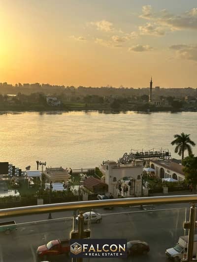 Apartment for sale, a bargain, with a 50% discount, including furniture, appliances, and air conditioners. All rooms have a panoramic view of the Nile