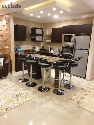 For rent furnished in Madinaty with super deluxe finishes and hotel furniture, a 96-square-meter apartment in B7, Wide Garden, steps from services