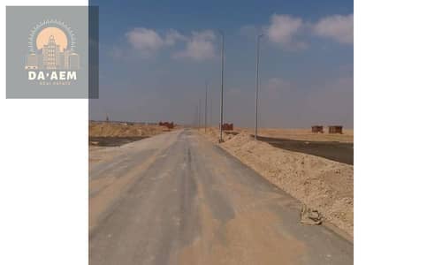 Land for sale in the Capital Gardens area, area 498, overlooking a garden - New Cairo