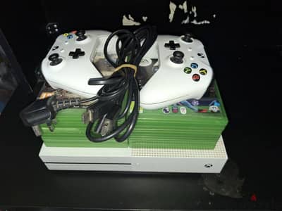 Xbox one s with two good controllers and 12 disk game