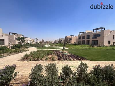 A finished villa with a lagoon view in Owest, Samih Sawiris, in front of Mall of Egypt,