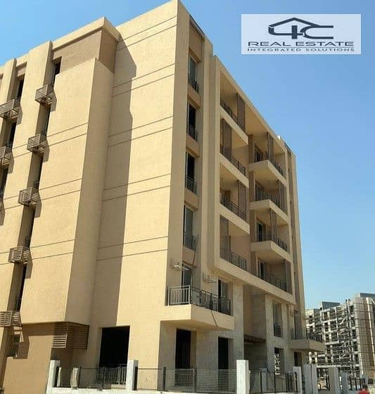 Apartment for sale in installments on a very special view on the landscape in front of Cairo Airport in the Taj City Compound 0