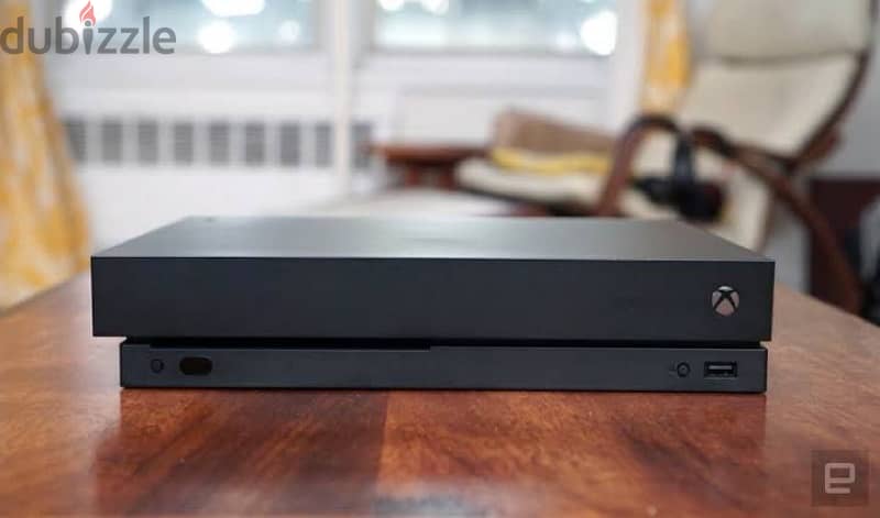 Xbox One X 1 T. B slightly Used 1