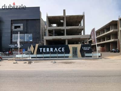 امتلك محل 70 متر + 111 تراس امام الجامعه الامريكيه السعر 27597822 مول v terrace