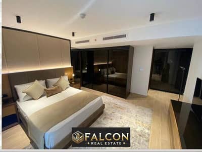 Receive immediately a fully finished hotel apartment managed by Marriott Hotel, with air conditioning and a garage, on the Suez Road - Heliopolis