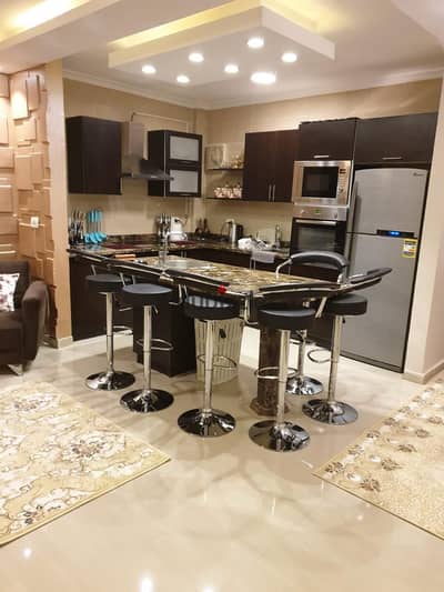 Opportunity for rent, furnished in Madinaty, with super deluxe finishes and hotel furniture, a 96-square-meter apartment in B7, overlooking a wide gar