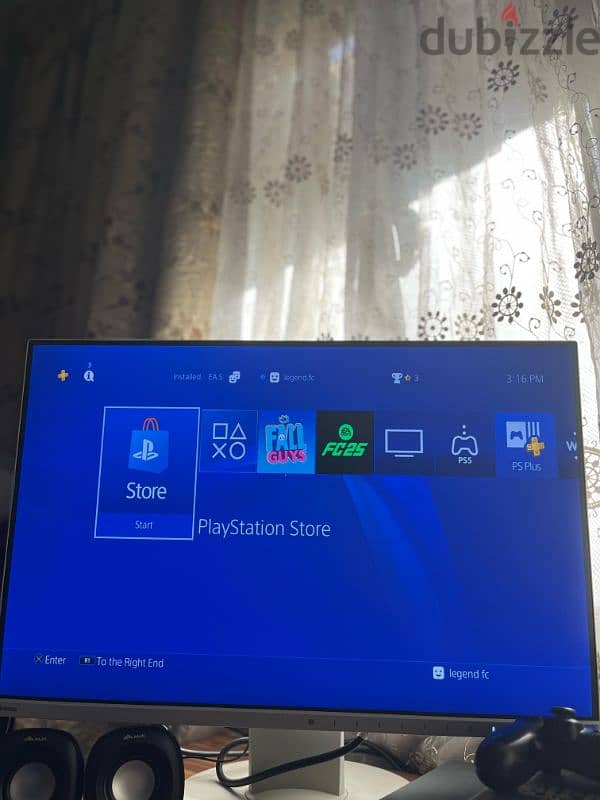 playstation 4 slim and a monitor 1