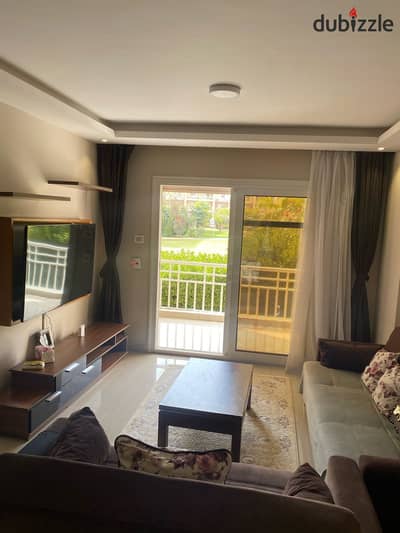 For rent furnished in Madinaty, a 96 sqm apartment with hotel furniture, overlooking a wide garden in B7