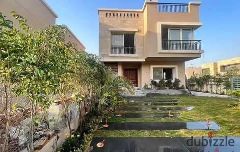 For sale, a double-view villa in Taj City, in front of Cairo Airport, minutes from 90th Street, Nasr City and the Fifth Settlement