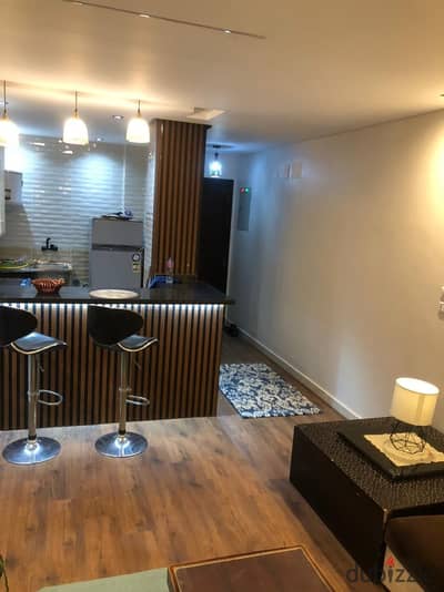 For sale in Madinaty, with super deluxe finishes, a 74-square-meter apartment in B12, a bargain location and price. The sale includes furniture and ap