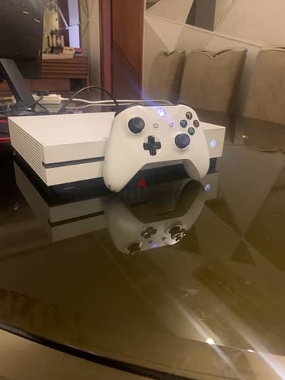 Xbox one s 1TB from KSA with two controllers + games