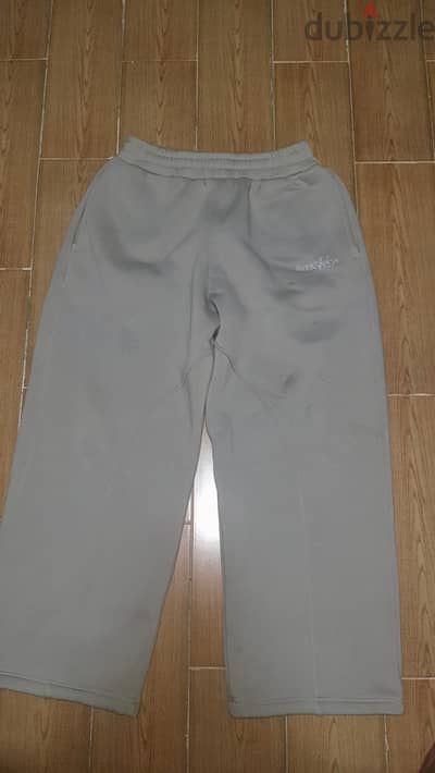 Baggy light grey sweatpants.