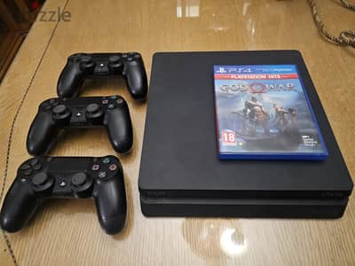 ps4 slim with 3 controllers and a cd