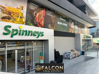 Shop for sale, 24 m², ready to move ,fully finished, in a prime location inside the mall next to Spinneys. in the largest mall inTaha  husain axis