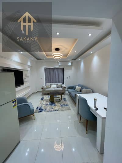 Available for rent, a 92-square-meter apartment, furnished with hotel furniture, in Rehab, a prime location in the ninth phase