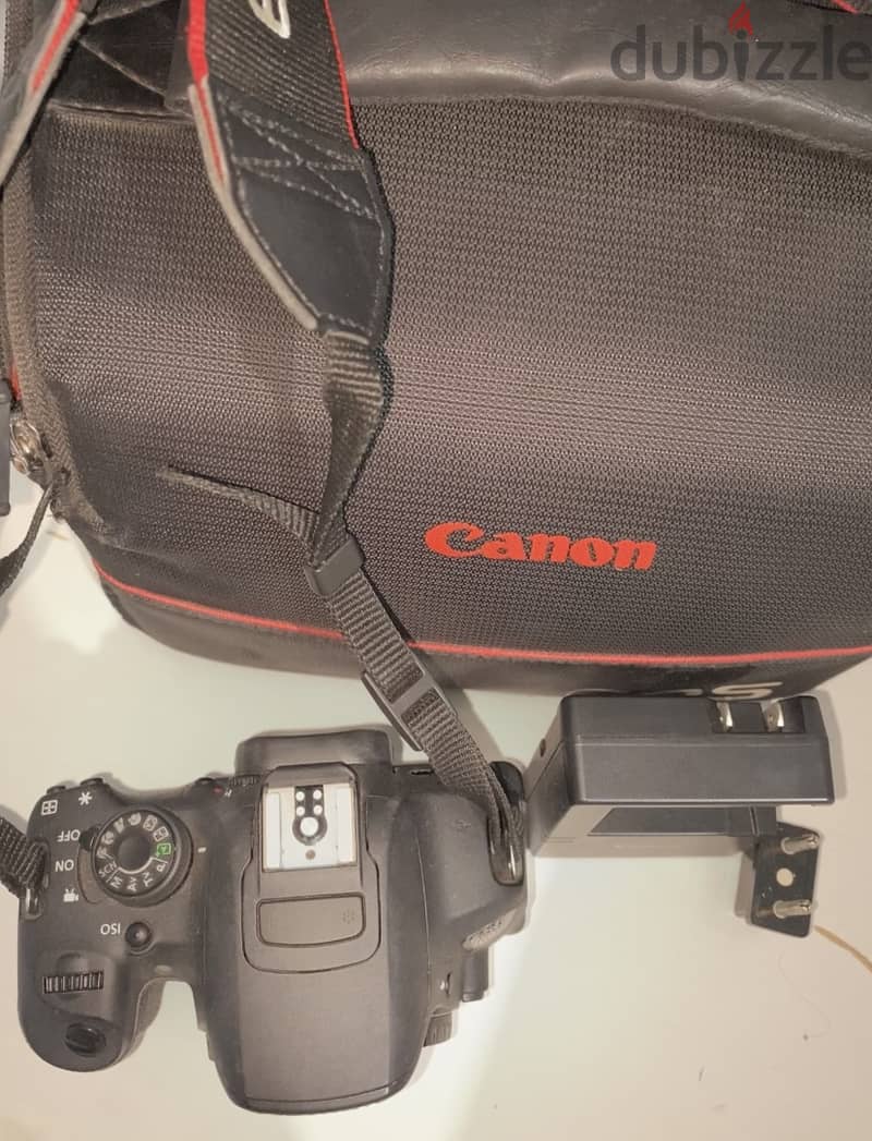 Canon 700D camera with an 18-135mm lens + battery + bag. 3