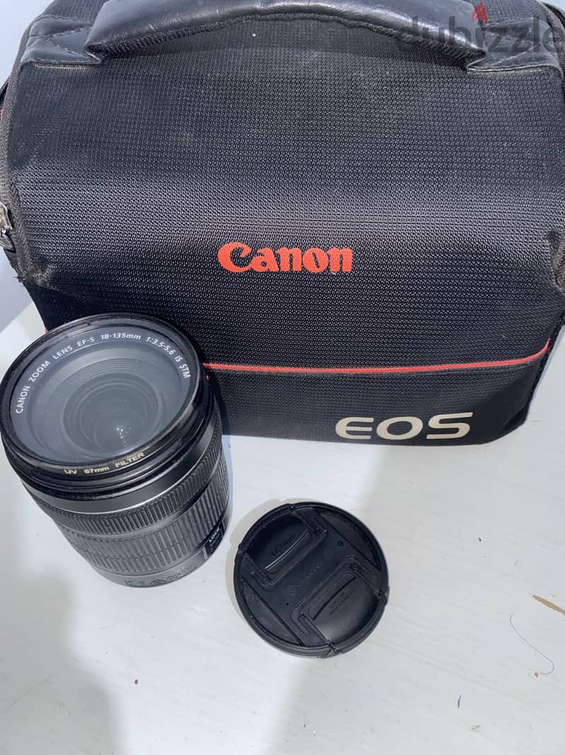 Canon 700D camera with an 18-135mm lens + battery + bag. 6