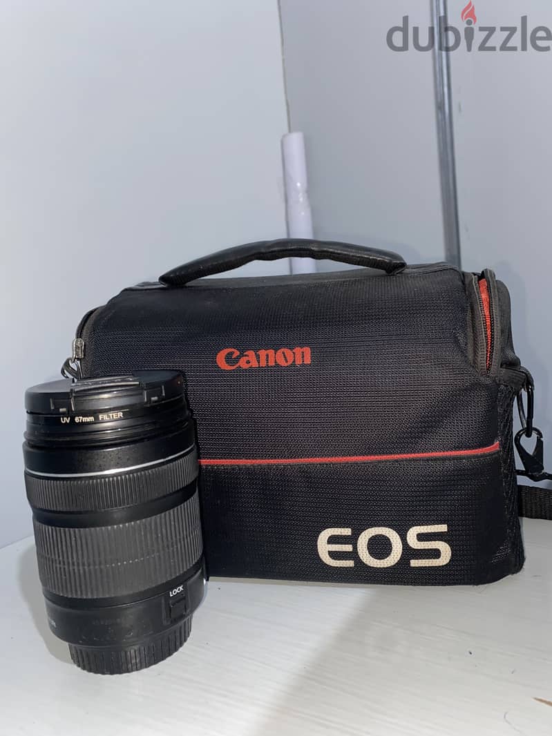 Canon 700D camera with an 18-135mm lens + battery + bag. 7