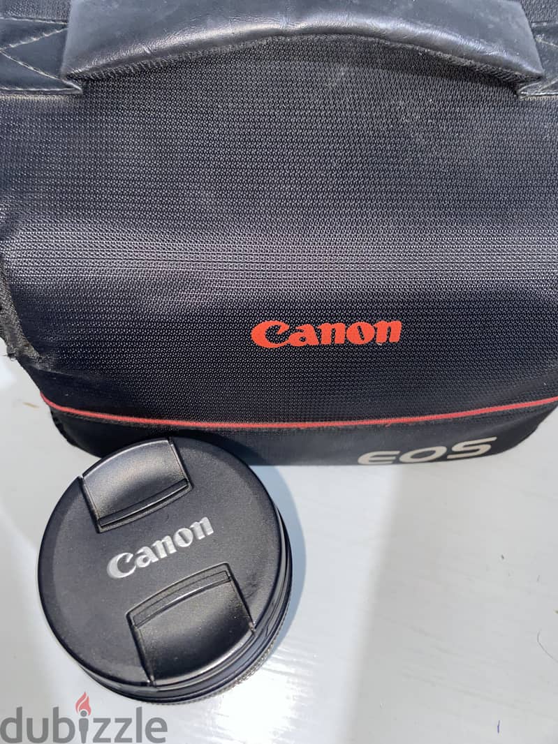 Canon 700D camera with an 18-135mm lens + battery + bag. 8