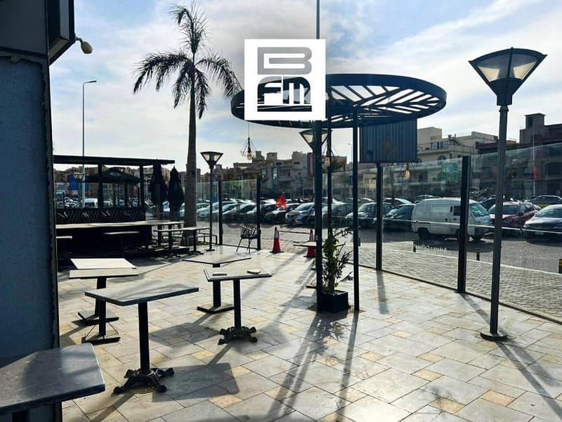 Fully finished restaurant for rent with a direct frontage on Mohammed Naguib Axis, located in the heart of New Cairo's Fifth Settlement. prime lo 0