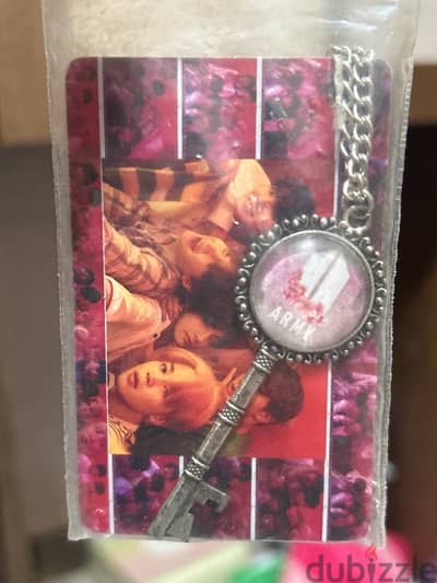 BTS photocard and necklace