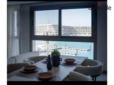 Elite Furnished Chalet with Sea View Direct on Marina for rent in Marassi North Coast , Modern furnisher with ACs. - Open view with the Beach -