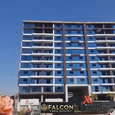 For sale, a 128-square-meter apartment directly on the Suez Road, next to City Center Almaza Mall, in the Marriott Residence Compound, fully finished.