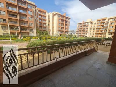 Apartment for rent in Wasal Compound, land area with a garden, area of ​​170 square meters, garden view