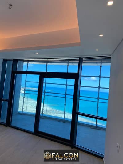 A fully finished, two-bedroom apartment with direct sea view, ready for immediate delivery, with air conditioning, in the New Alamein Towers, North Co