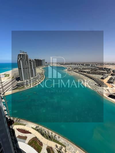 Chalet for sale, 217 m, fully finished, on the 28th floor, New Alamein Towers, North Coast, delivery soon, with a sea and lagoon view