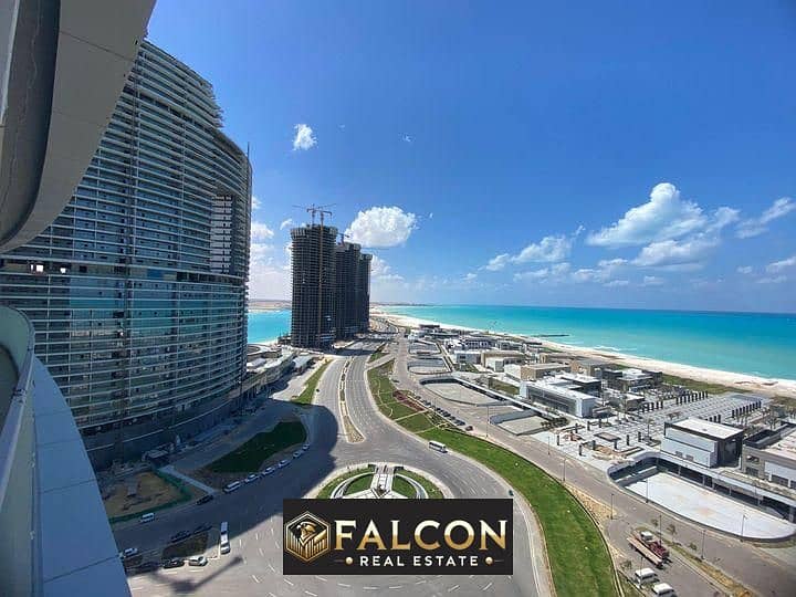 A fully finished sea-view apartment with air conditioning, ready for immediate delivery in the New Alamein Towers, with payment plans up to 12 years. 0