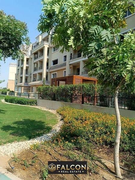 An apartment with a distinctive view and a fantastic location on the Suez Direct Road in Sarai Compound, with payment plans of up to 12 years. 0