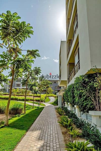 Apartment for sale with a distinctive view of   green spaces for half the price reservation and contract on the same day   In Taj City Compound i