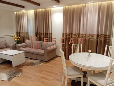 For lovers of luxurious finishes, a ground floor studio with a garden for rent, furnished in Madinaty, with ultra super deluxe finishes, directly in f