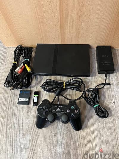 بلايستيشن 2  ومعاه دراعين  العاب )ps2 slim