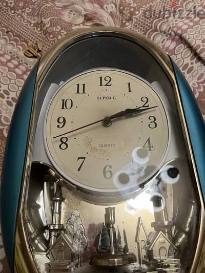 Wall clock with moving toys and music for sale