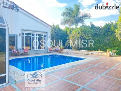 Villa for sale in Al Rabwa Sheikh Zayed with a swimming pool overlooking the golf course