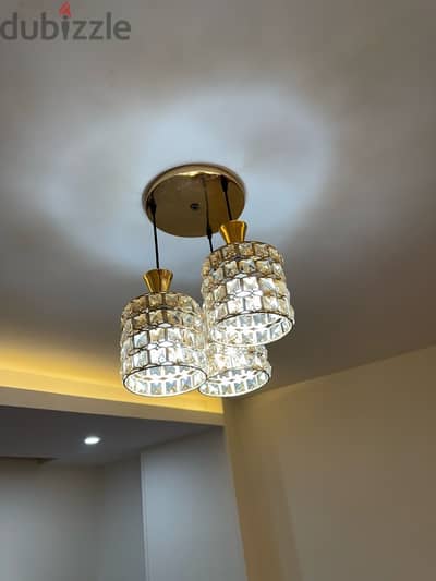 A set of modern chandeliers in gold and white for sale, completely new