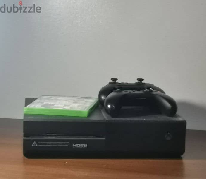 Xbox One 1 TB with a game 9